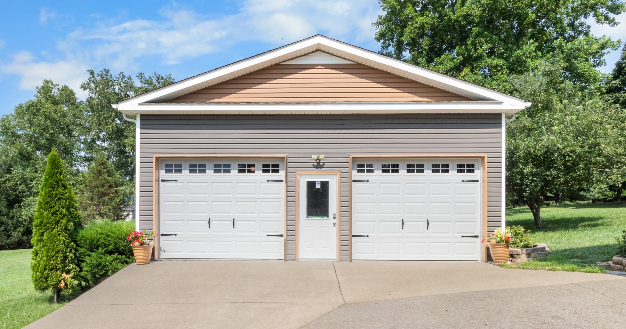 901 Riverchase Road Adams, TN 37010 - Photo 3 of 35 a front view of a house with a garage