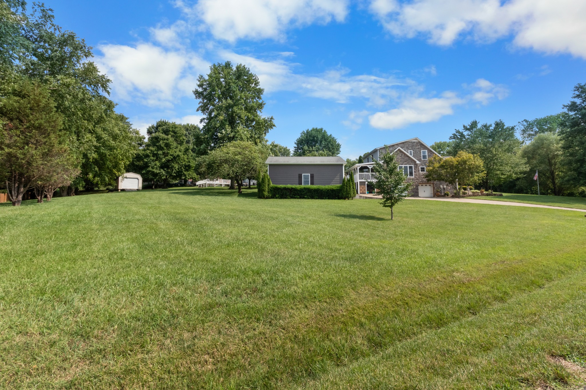 901 Riverchase Road Adams, TN 37010 - Photo 33 of 35 a view of a big yard with a house in the background