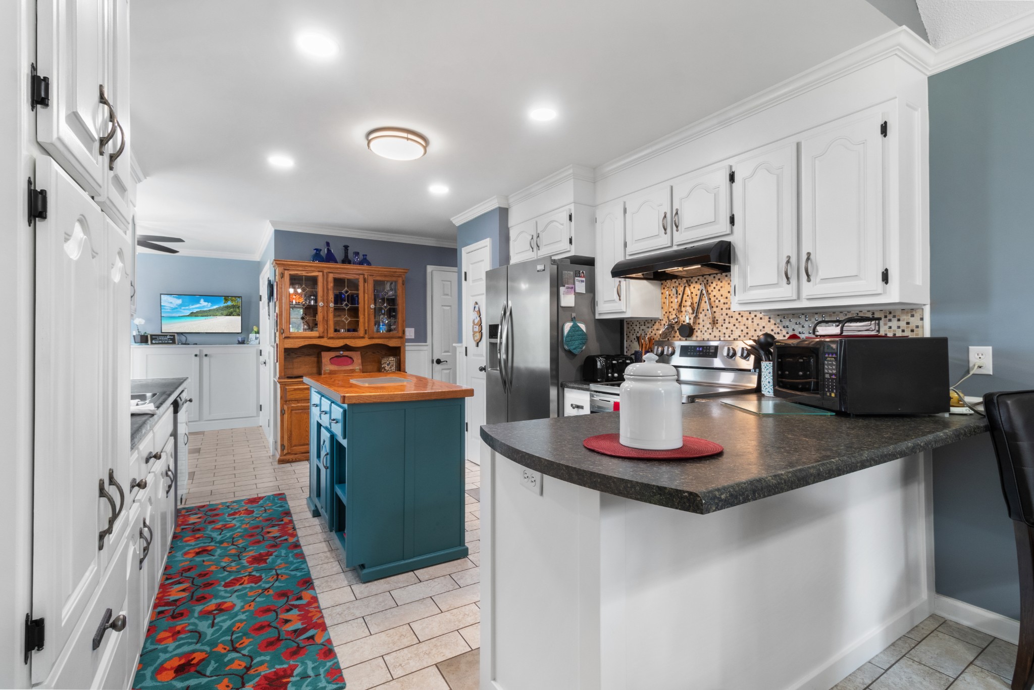 901 Riverchase Road Adams, TN 37010 - Photo 10 of 35 a kitchen with lots of counter top space and wooden floor
