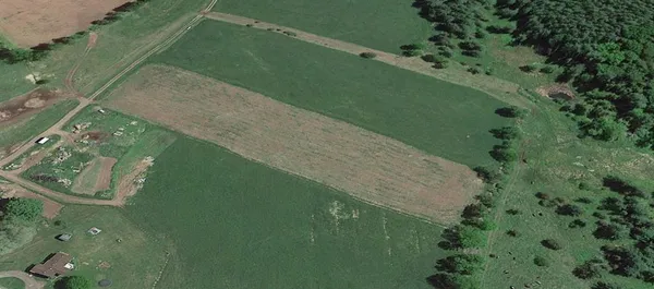 a view of a lake with a yard