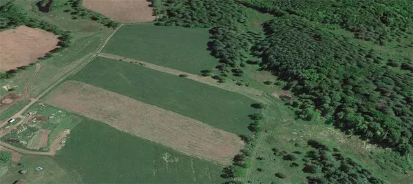 a view of a lake with a yard