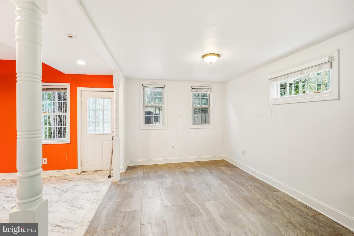6712 6th Street Northwest Washington, DC 20012 - Photo 17 of 41 an empty room with wooden floor and windows