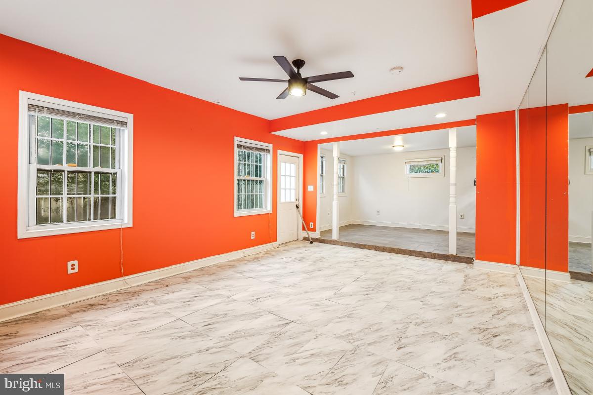6712 6th Street Northwest Washington, DC 20012 - Photo 19 of 41 a view of a livingroom with a ceiling fan and window
