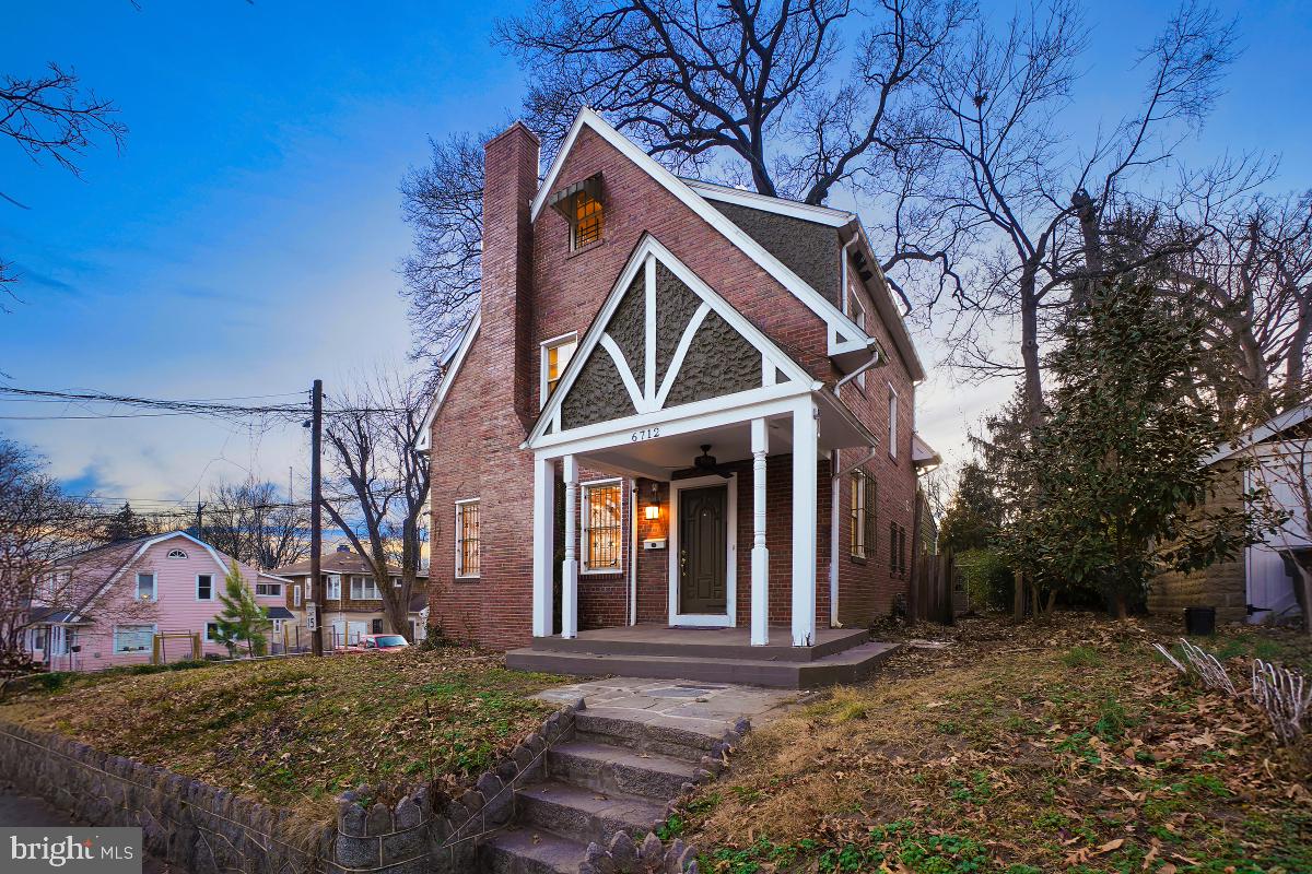 6712 6th Street Northwest Washington, DC 20012 - Photo 2 of 41 a front view of a house with a yard