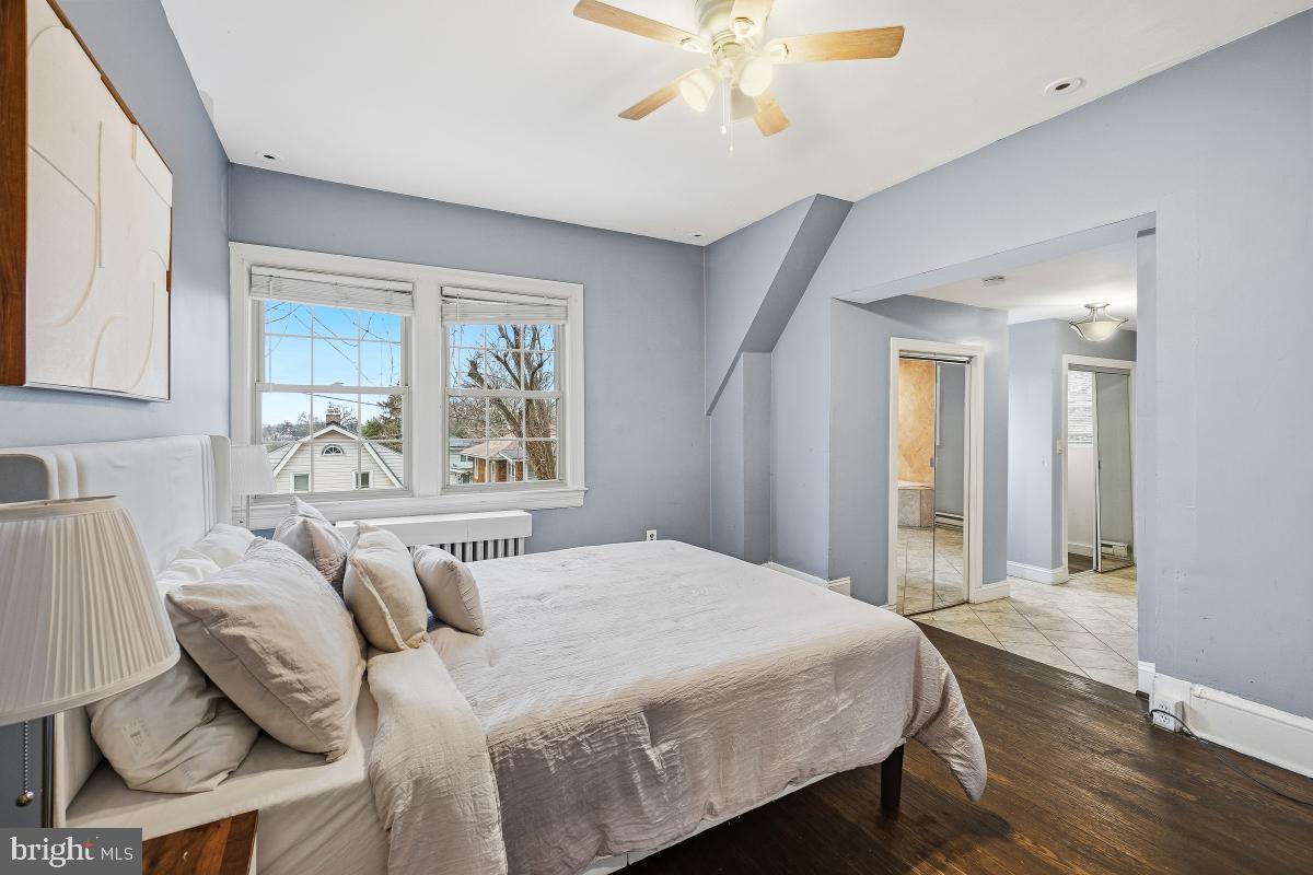 6712 6th Street Northwest Washington, DC 20012 - Photo 22 of 41 a bedroom with a large bed and a window