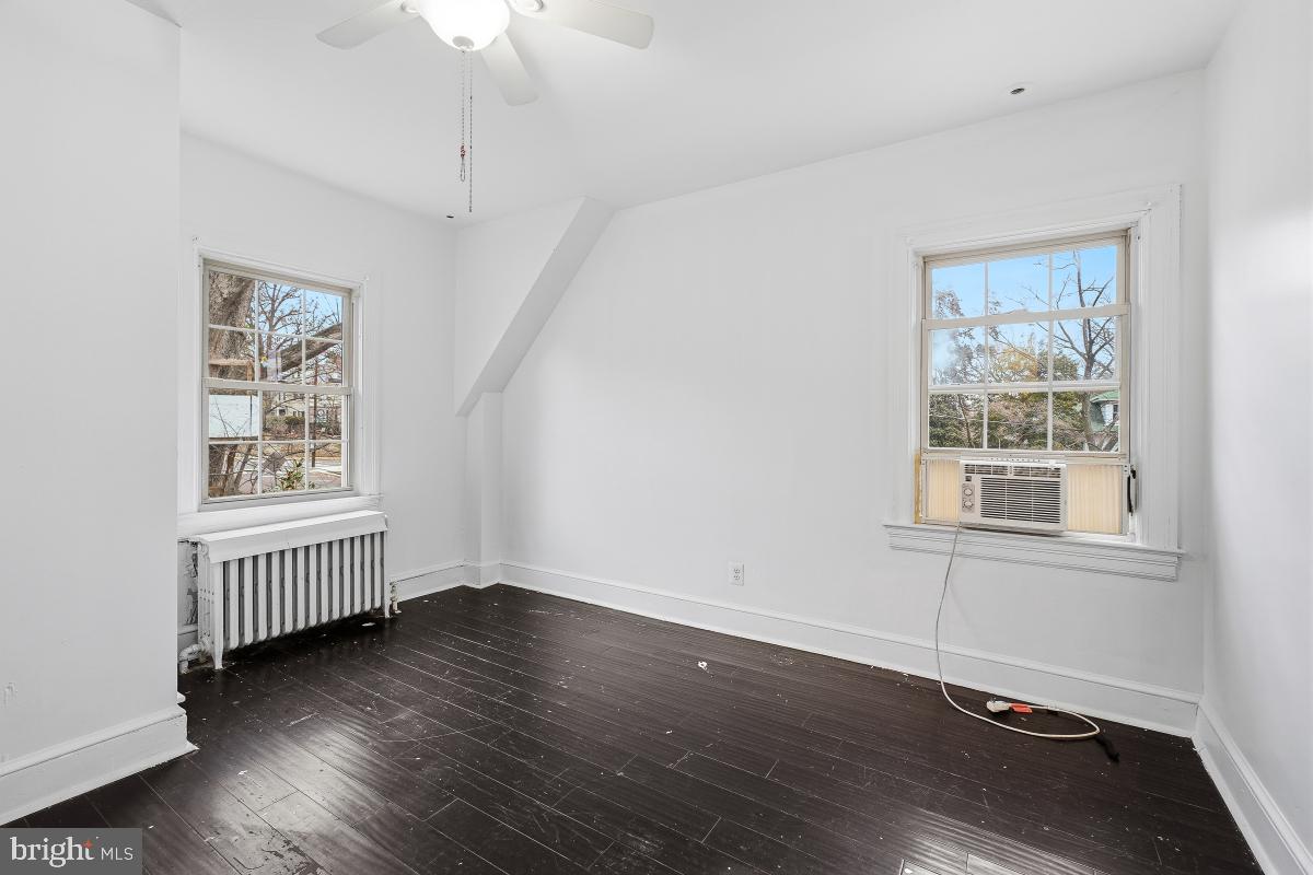 6712 6th Street Northwest Washington, DC 20012 - Photo 25 of 41 a view of an empty room with wooden floor and a window