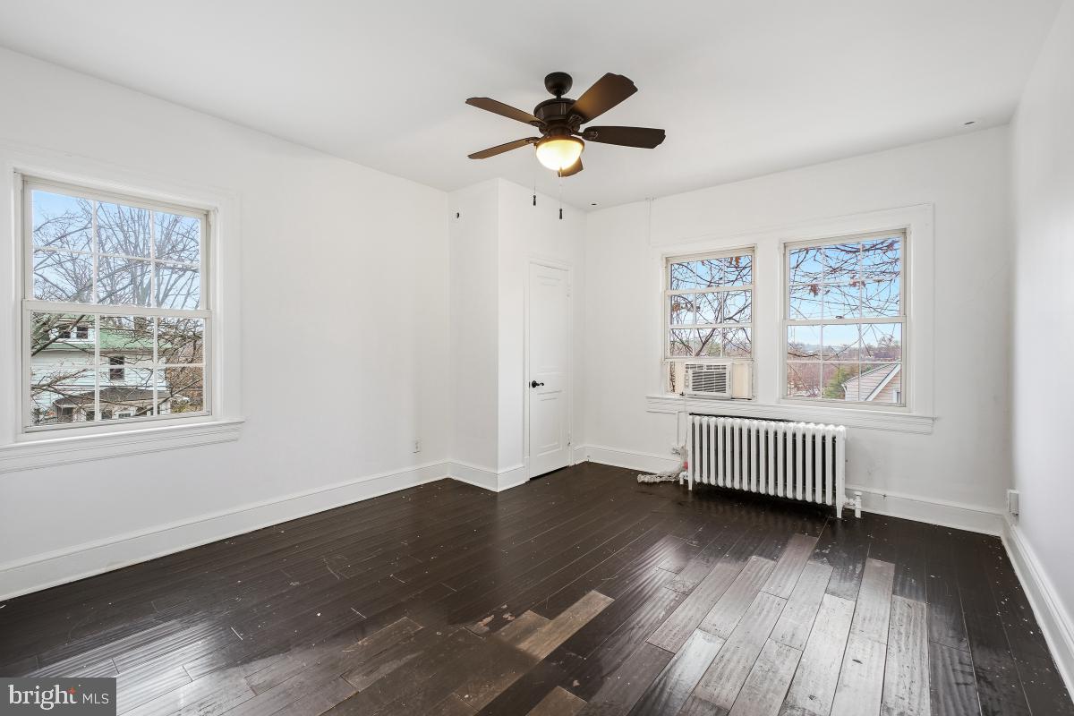 6712 6th Street Northwest Washington, DC 20012 - Photo 26 of 41 wooden floor in an empty room with a window
