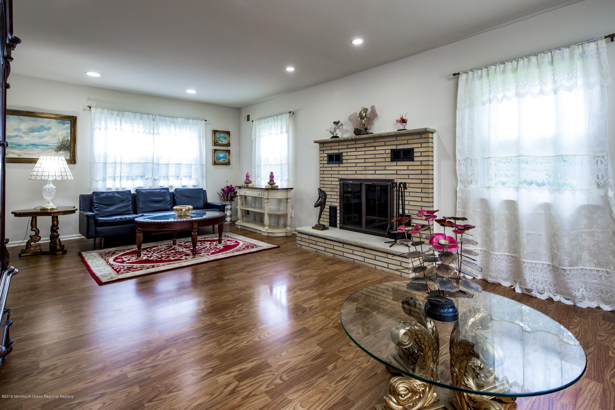 503 Wildwood Road West Allenhurst, NJ 07711 - Photo 12 of 26 a living room with furniture and a fireplace