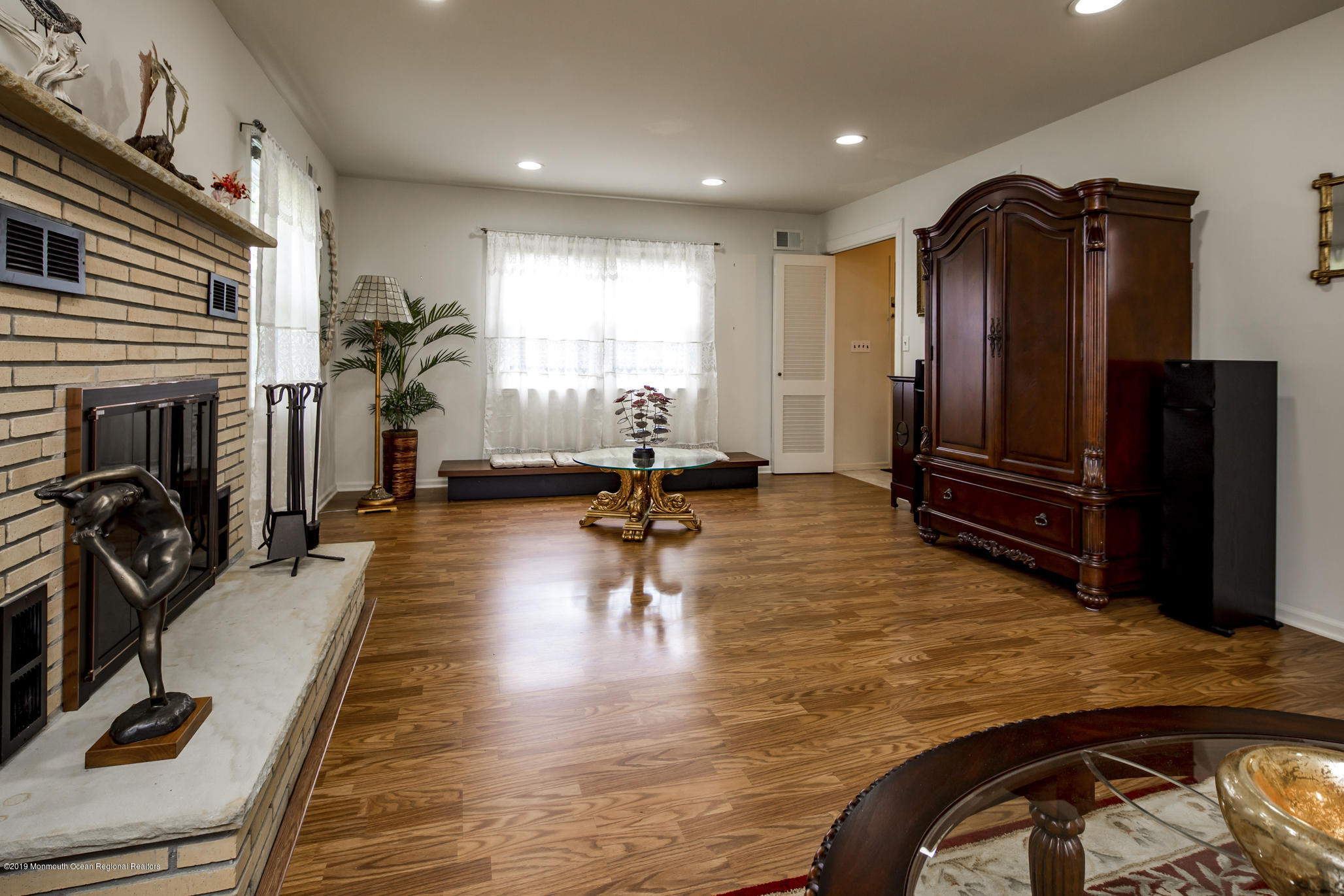 503 Wildwood Road West Allenhurst, NJ 07711 - Photo 14 of 26 a living room with furniture gym equipment and a flat screen tv