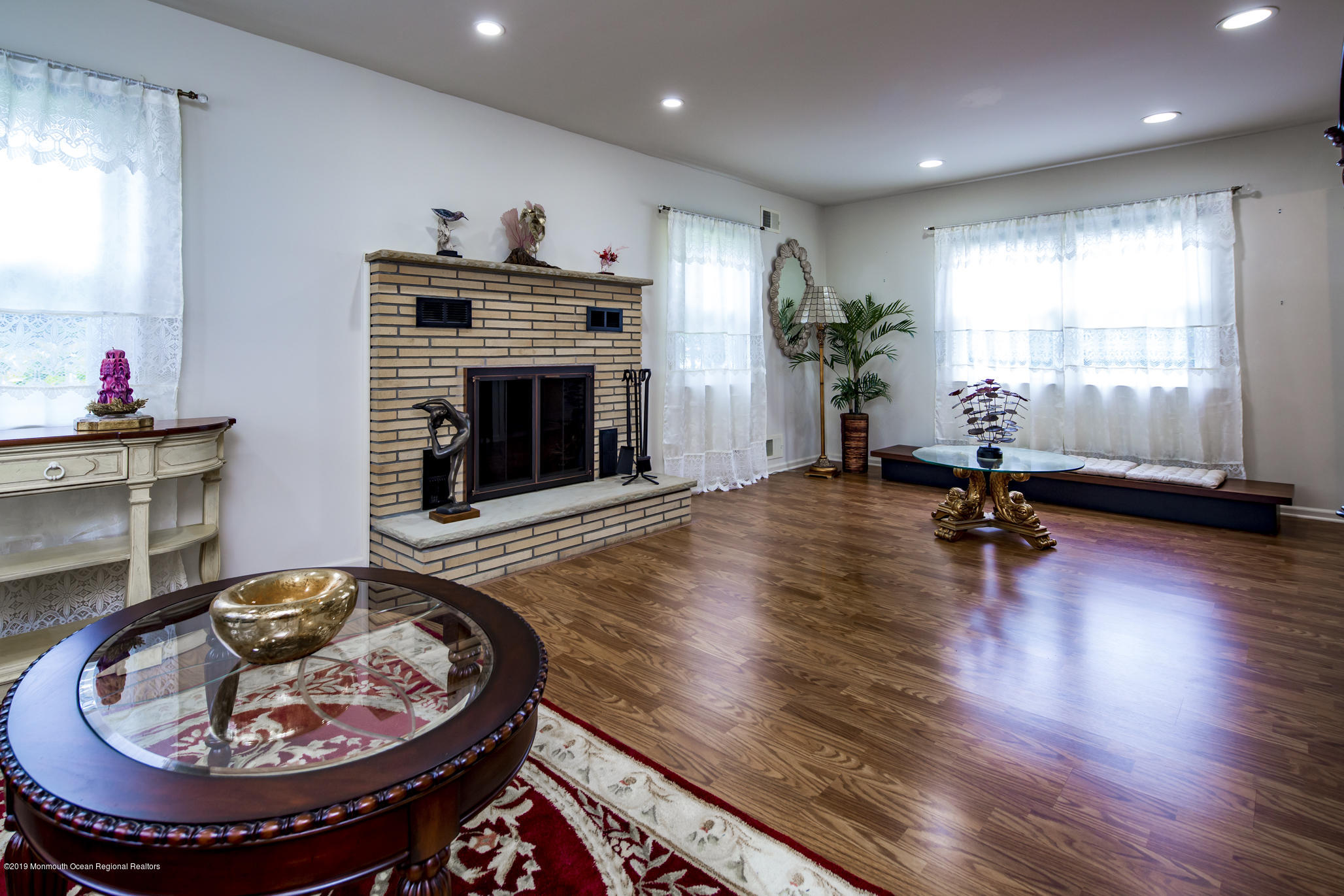 503 Wildwood Road West Allenhurst, NJ 07711 - Photo 15 of 26 a living room with furniture and a fireplace