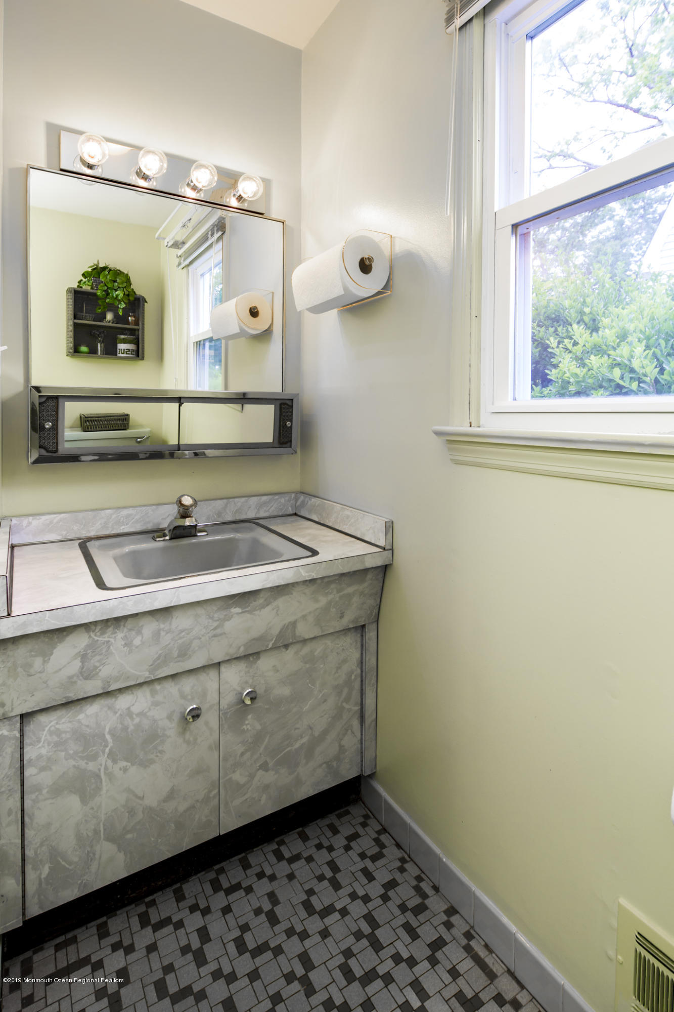 503 Wildwood Road West Allenhurst, NJ 07711 - Photo 16 of 26 a bathroom with a sink a mirror and shower
