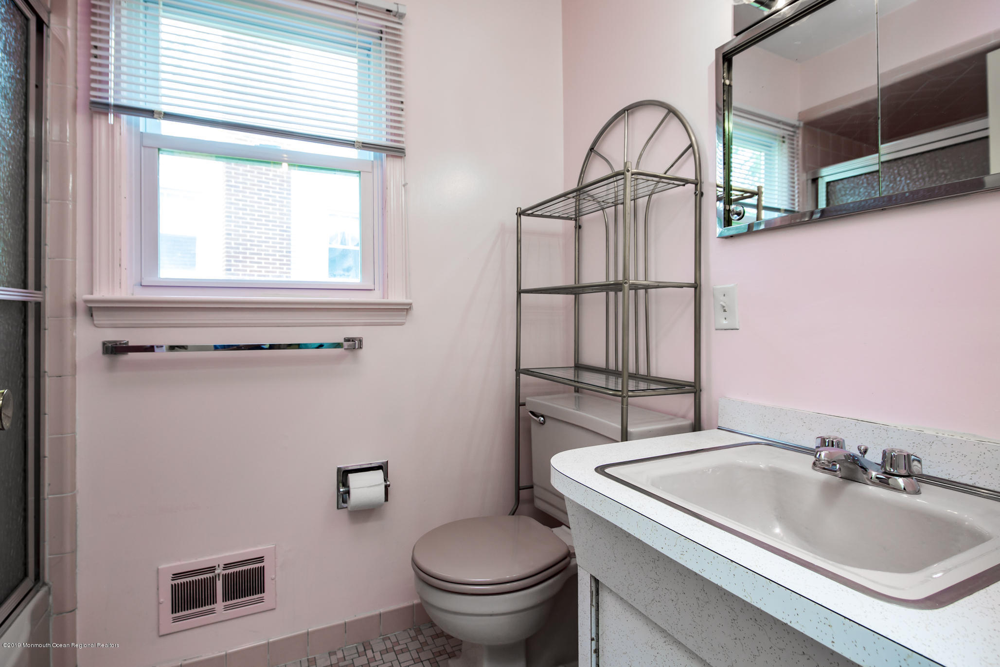 503 Wildwood Road West Allenhurst, NJ 07711 - Photo 19 of 26 a bathroom with a sink toilet and a mirror