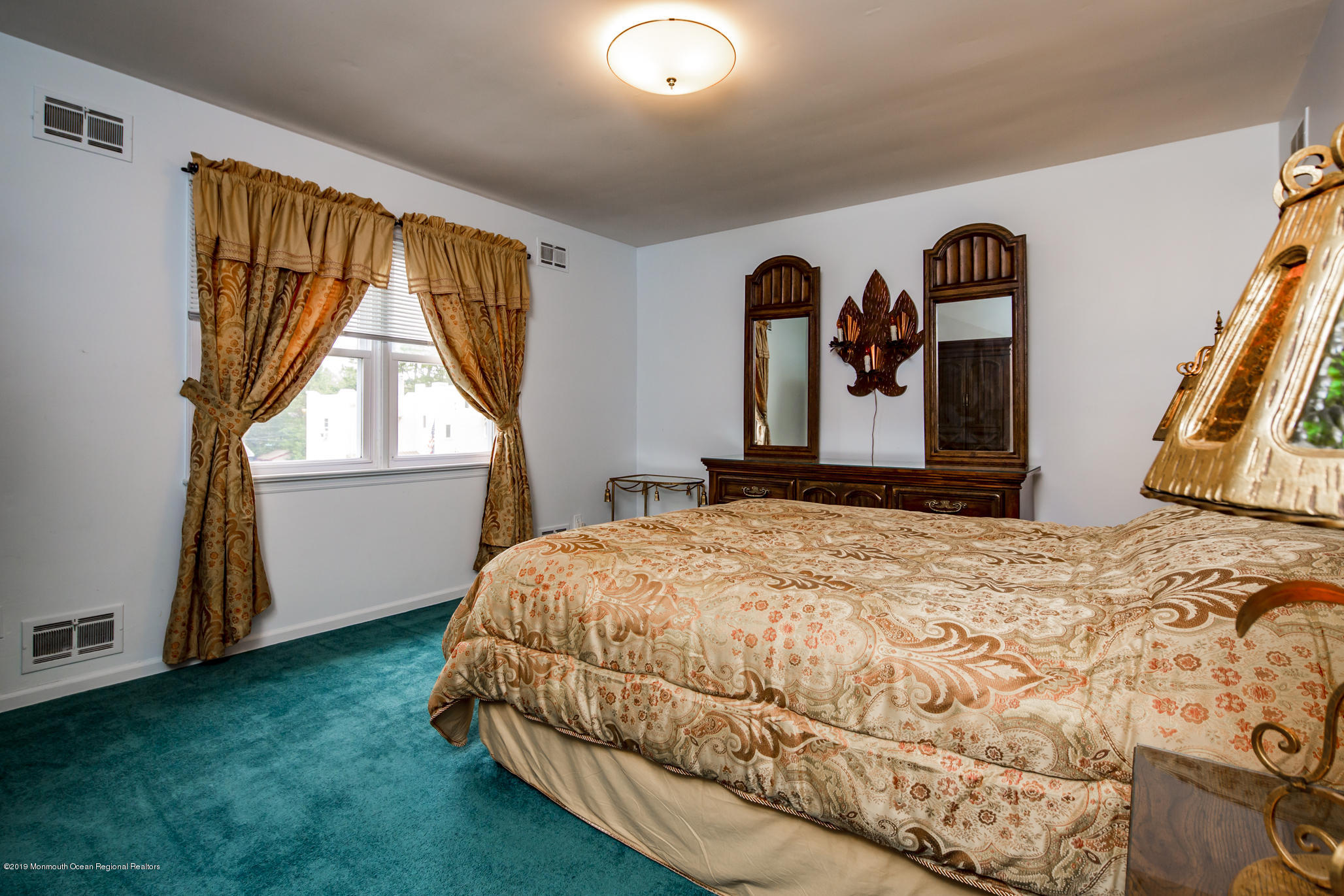 503 Wildwood Road West Allenhurst, NJ 07711 - Photo 20 of 26 a bedroom with a bed and a window