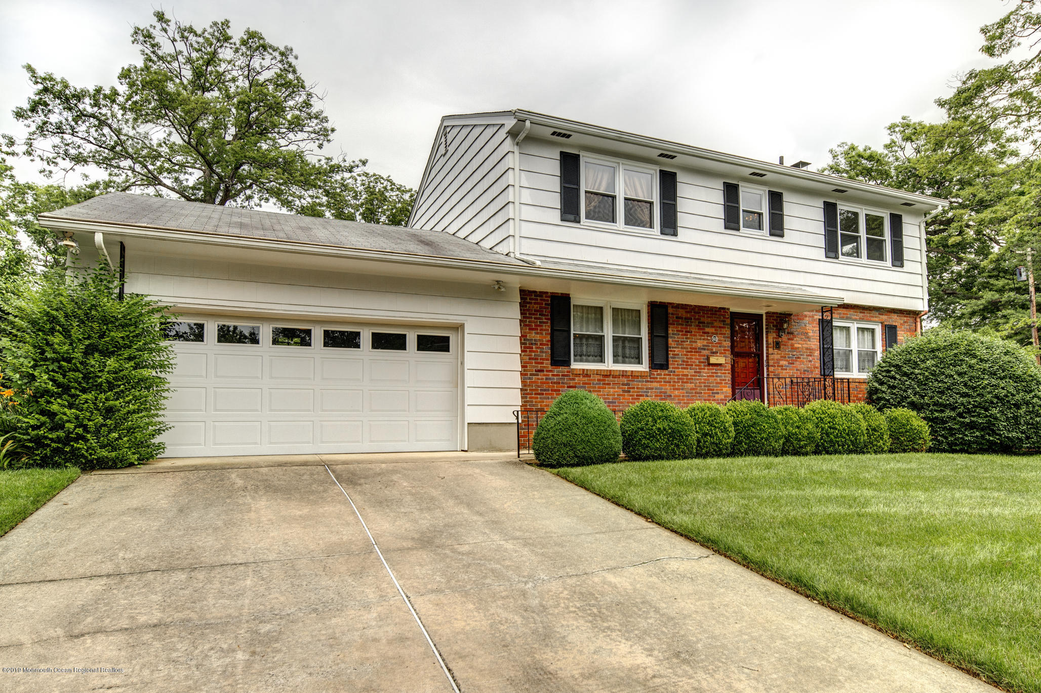 503 Wildwood Road West Allenhurst, NJ 07711 - Photo 2 of 26 a front view of a house with yard and green space