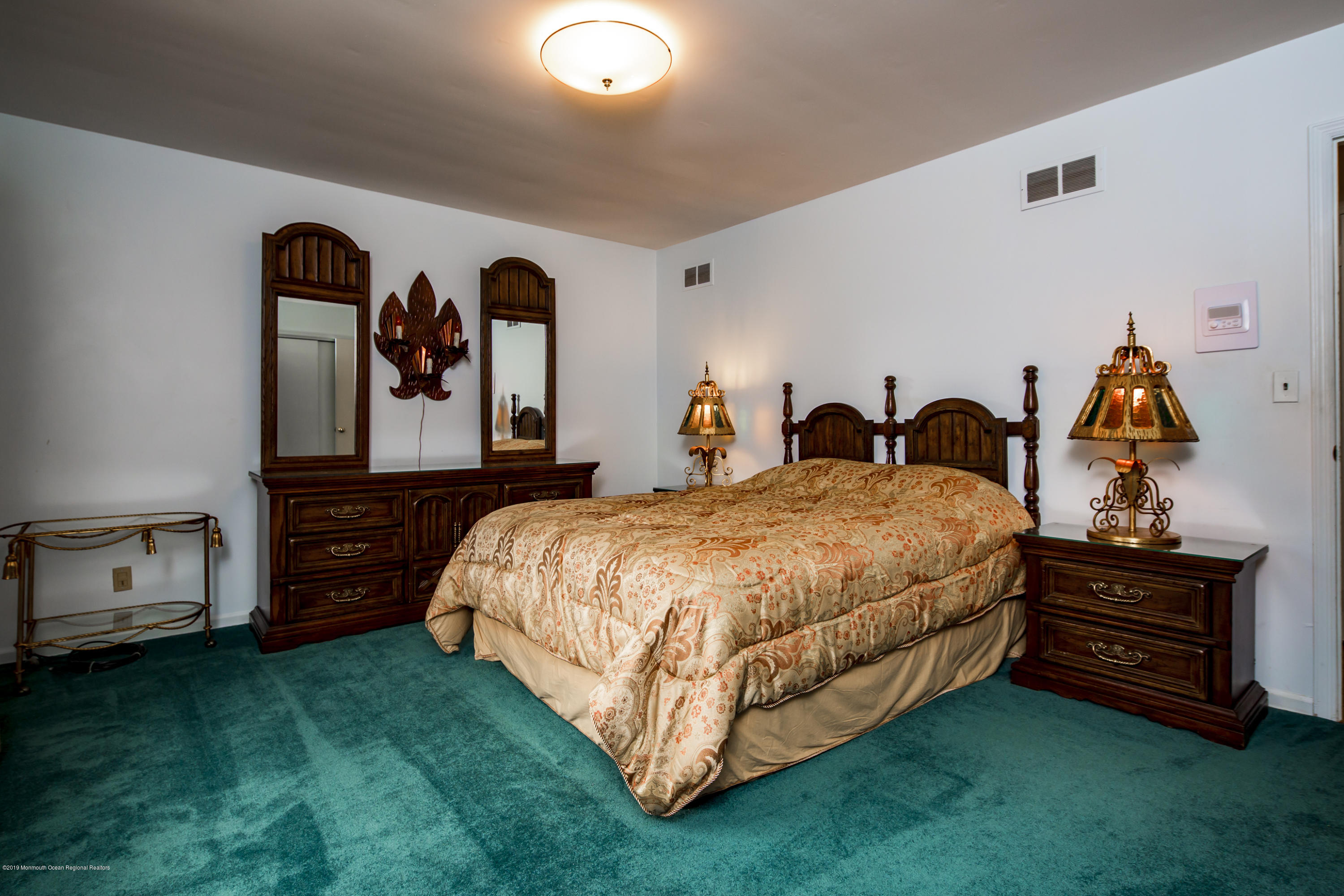 503 Wildwood Road West Allenhurst, NJ 07711 - Photo 21 of 26 a bed room with a bed and a television
