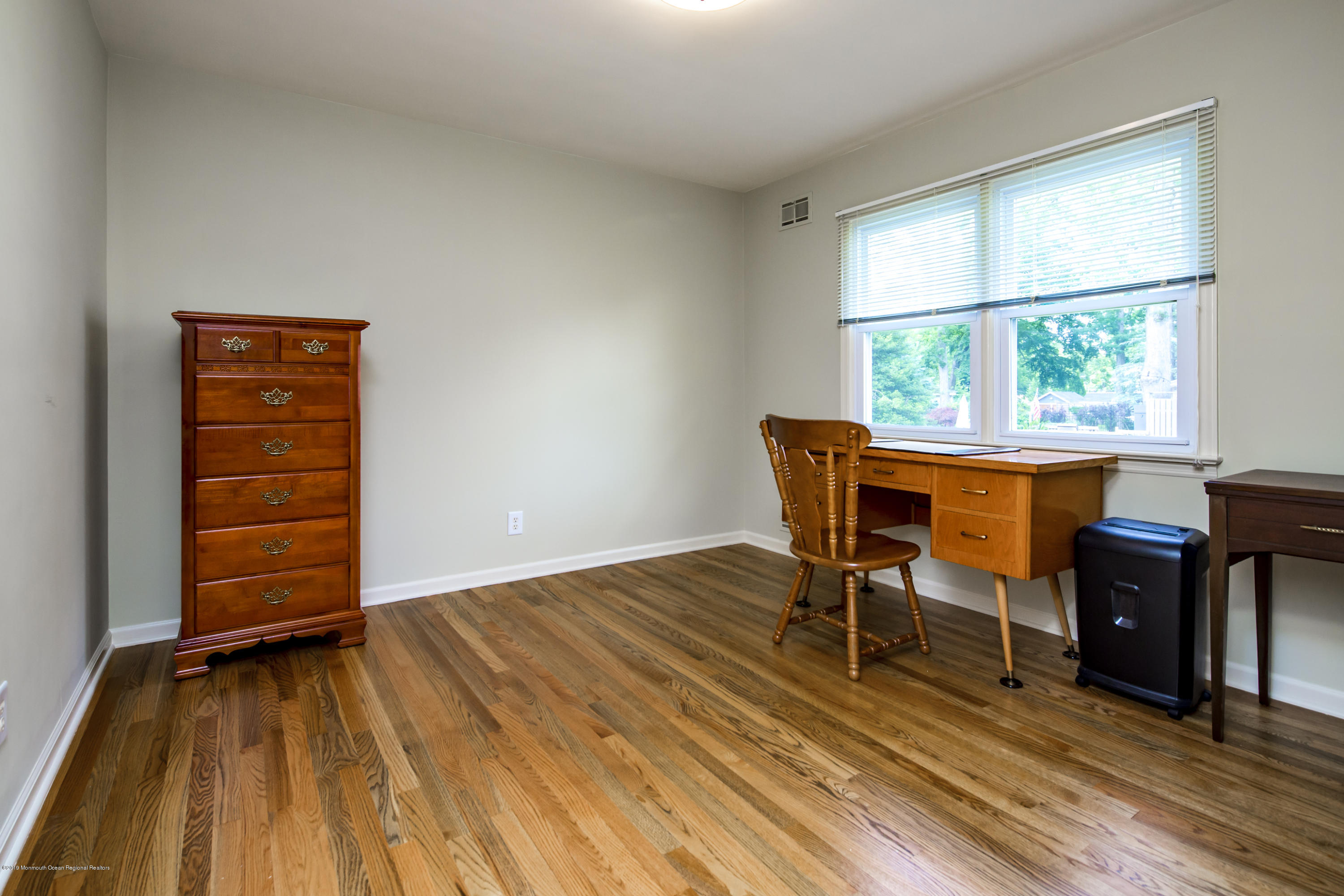 503 Wildwood Road West Allenhurst, NJ 07711 - Photo 23 of 26 a view of a dining room with furniture and wooden floor