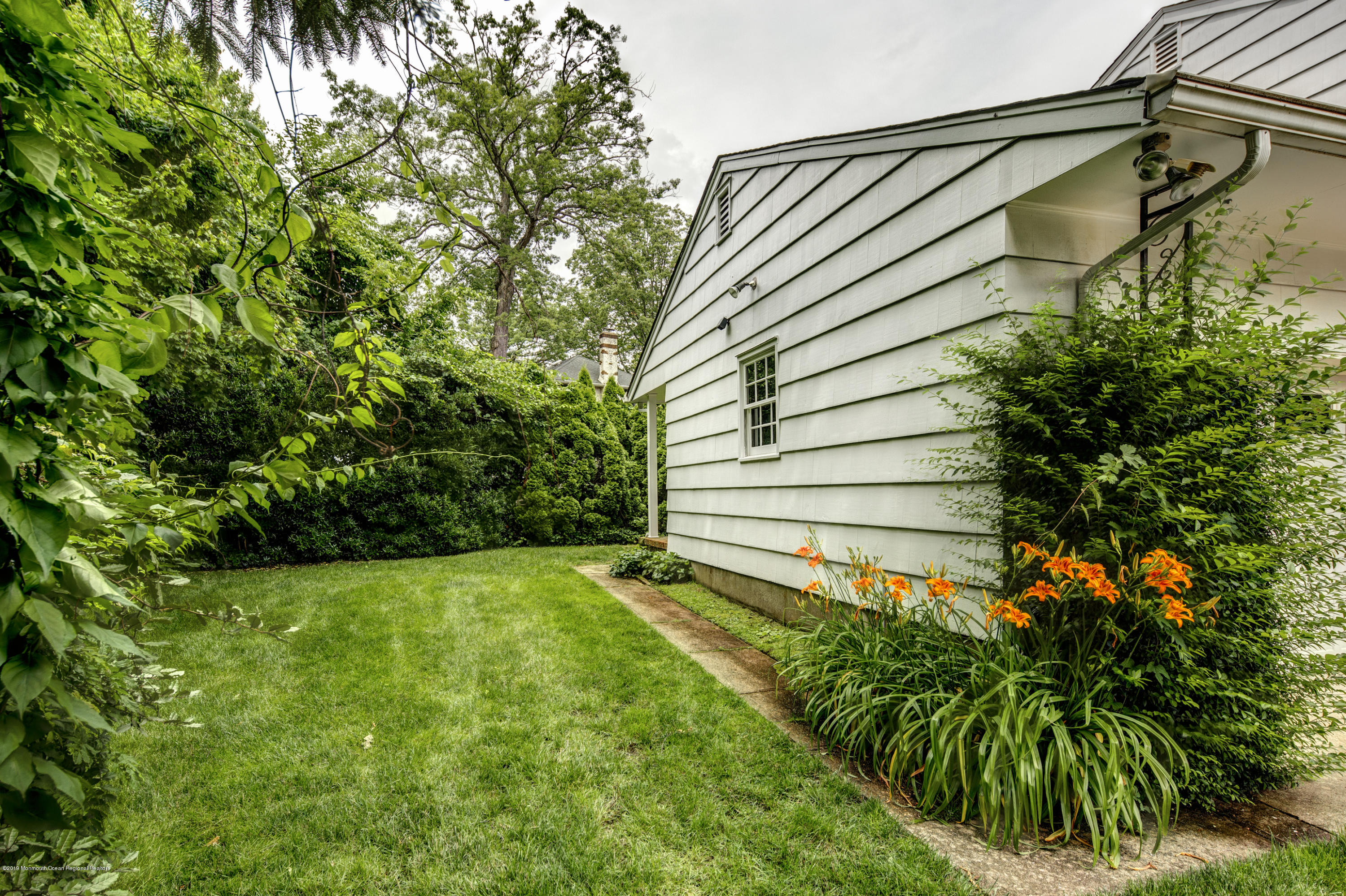 503 Wildwood Road West Allenhurst, NJ 07711 - Photo 24 of 26 a view of a backyard with plants
