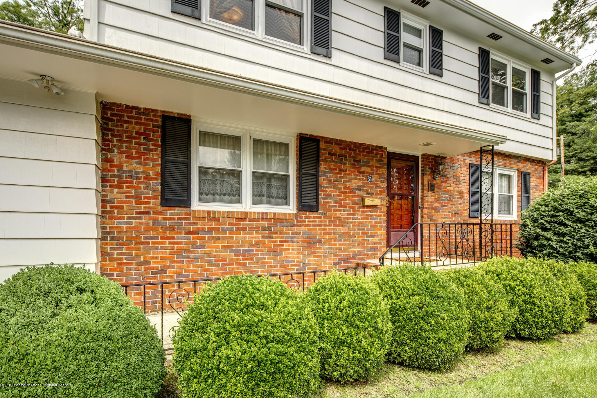 503 Wildwood Road West Allenhurst, NJ 07711 - Photo 4 of 26 front view of a brick house