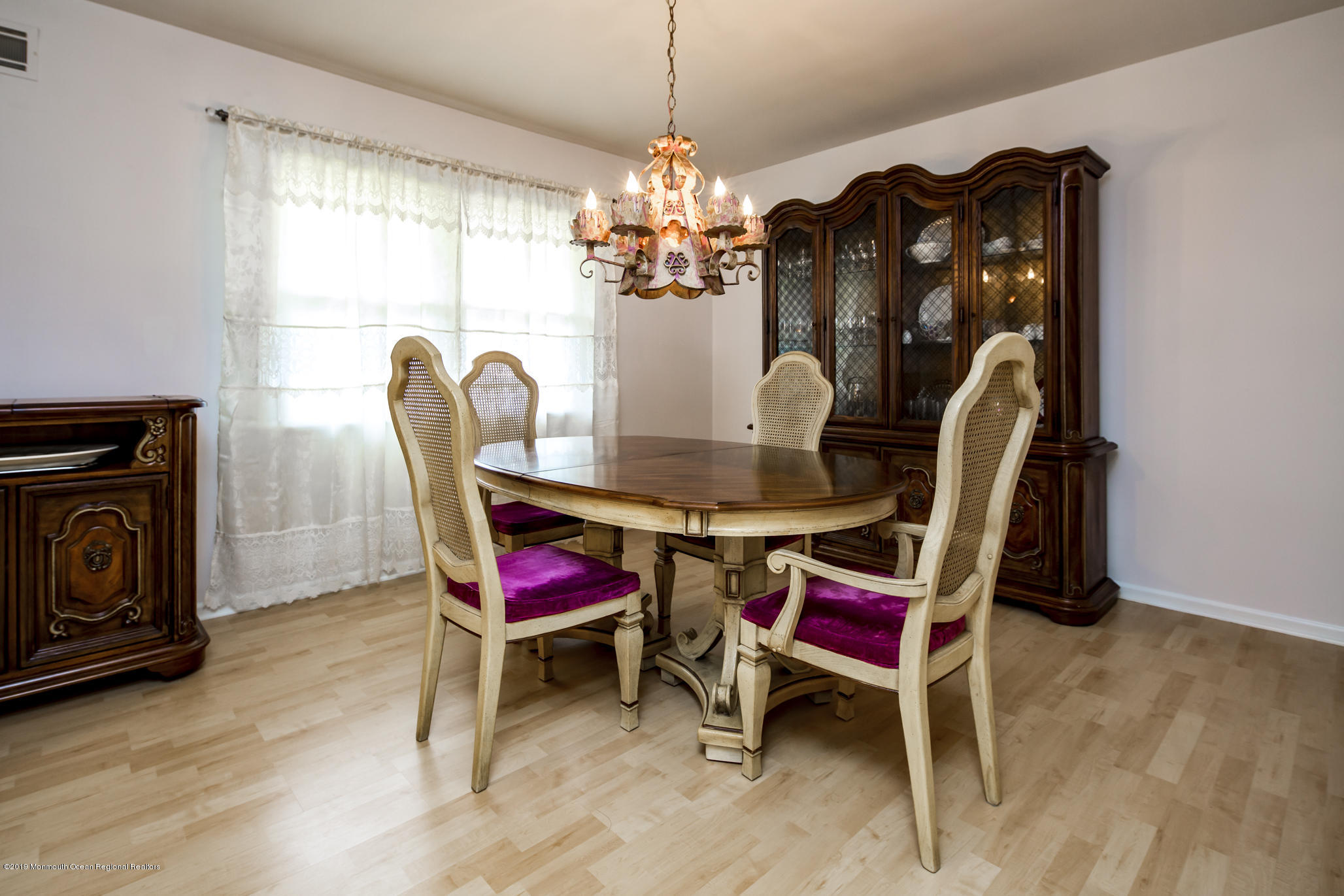 503 Wildwood Road West Allenhurst, NJ 07711 - Photo 10 of 26 a view of a dining room with furniture and chandelier