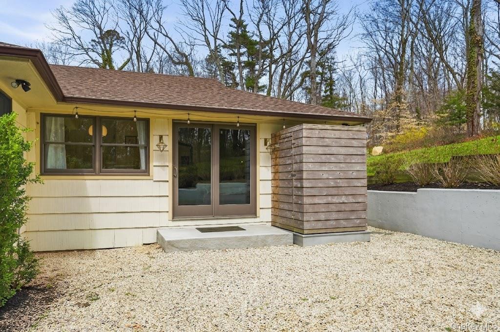 6 Greatmeadow Road Locust Valley, NY 11560 - Photo 39 of 48 Outside shower off of primary bedroom w/ privacy hedge