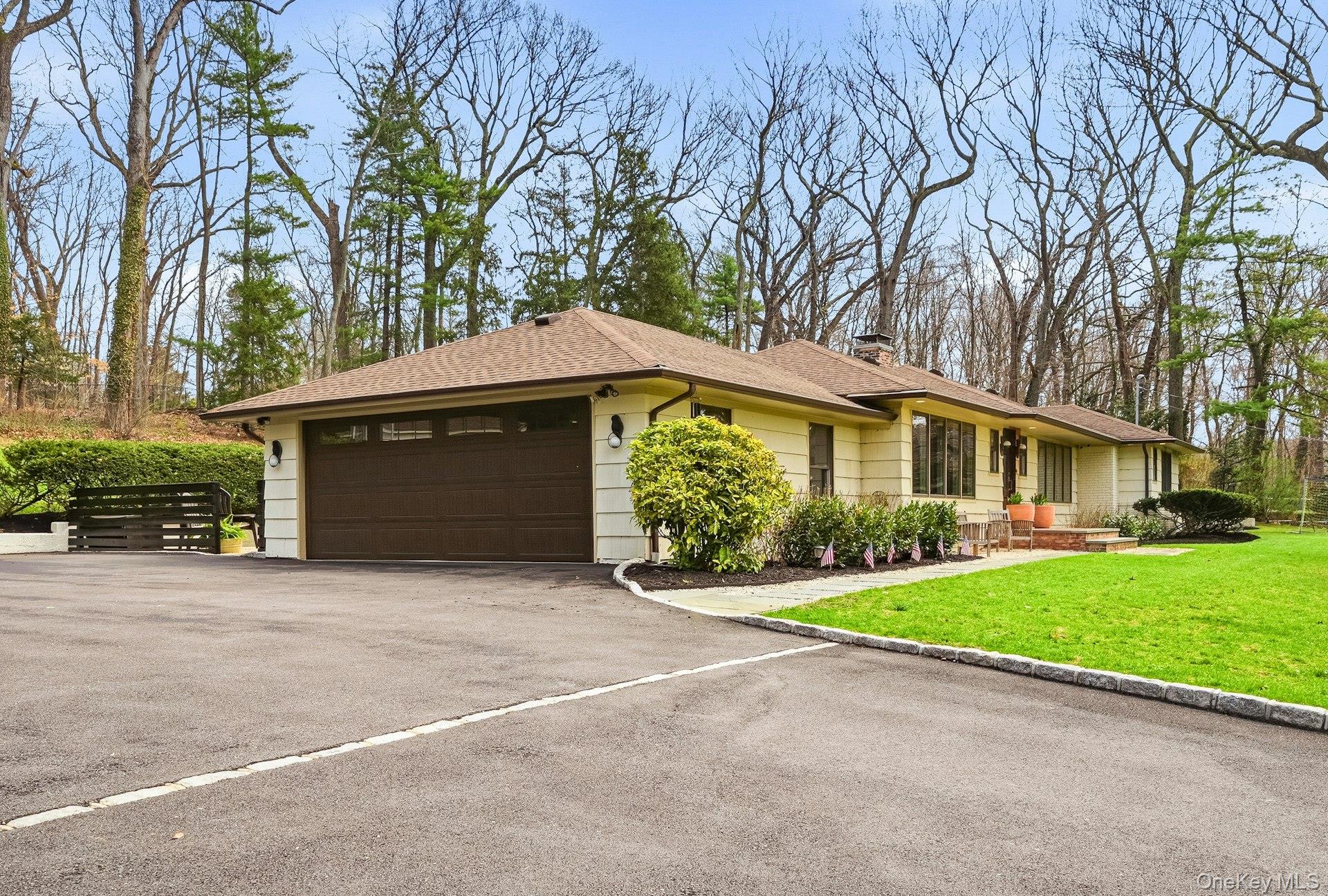 6 Greatmeadow Road Locust Valley, NY 11560 - Photo 44 of 48 2 car attached garage w/ new 18' single door, epoxy floors, full sized windows and utility sink & a heater