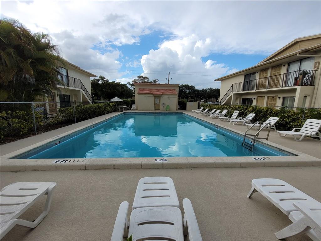 11096 Royal Palm Boulevard, Unit 11096 Coral Springs, FL 33065 - Photo 11 of 20 a view of a house with a yard
