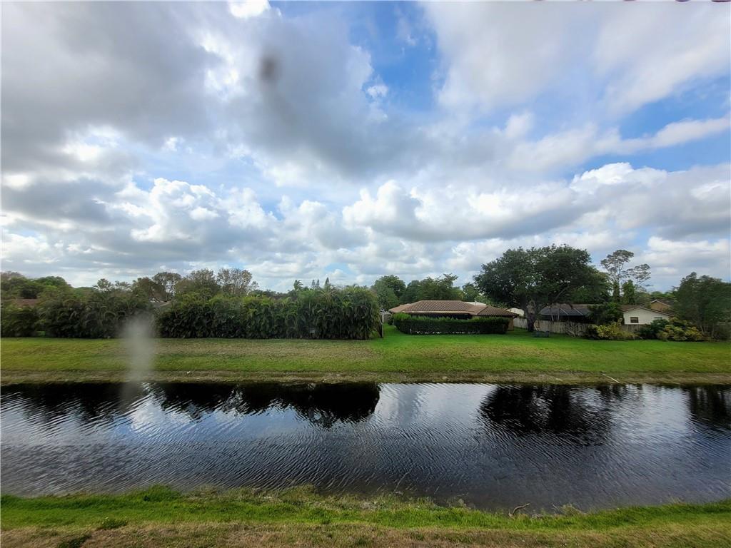 11096 Royal Palm Boulevard, Unit 11096 Coral Springs, FL 33065 - Photo 14 of 20 a view of a lake