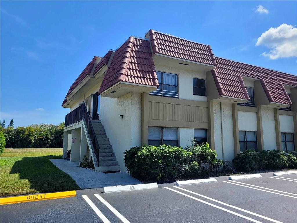 11096 Royal Palm Boulevard, Unit 11096 Coral Springs, FL 33065 - Photo 16 of 20 a front view of a house with a yard