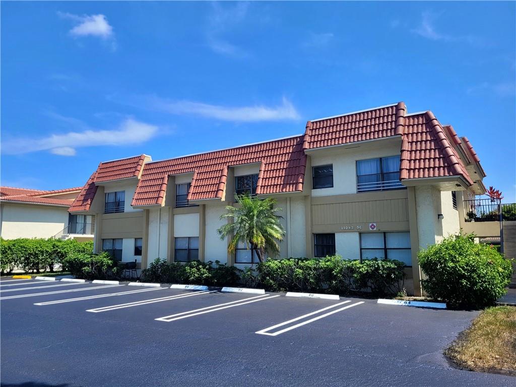 11096 Royal Palm Boulevard, Unit 11096 Coral Springs, FL 33065 - Photo 17 of 20 a front view of a house with a yard