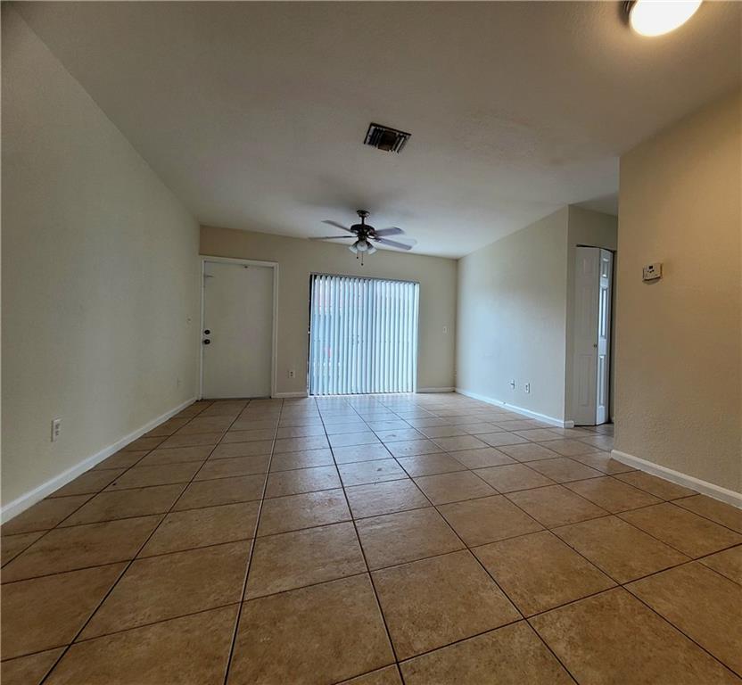 11096 Royal Palm Boulevard, Unit 11096 Coral Springs, FL 33065 - Photo 5 of 20 a view of an empty room and window