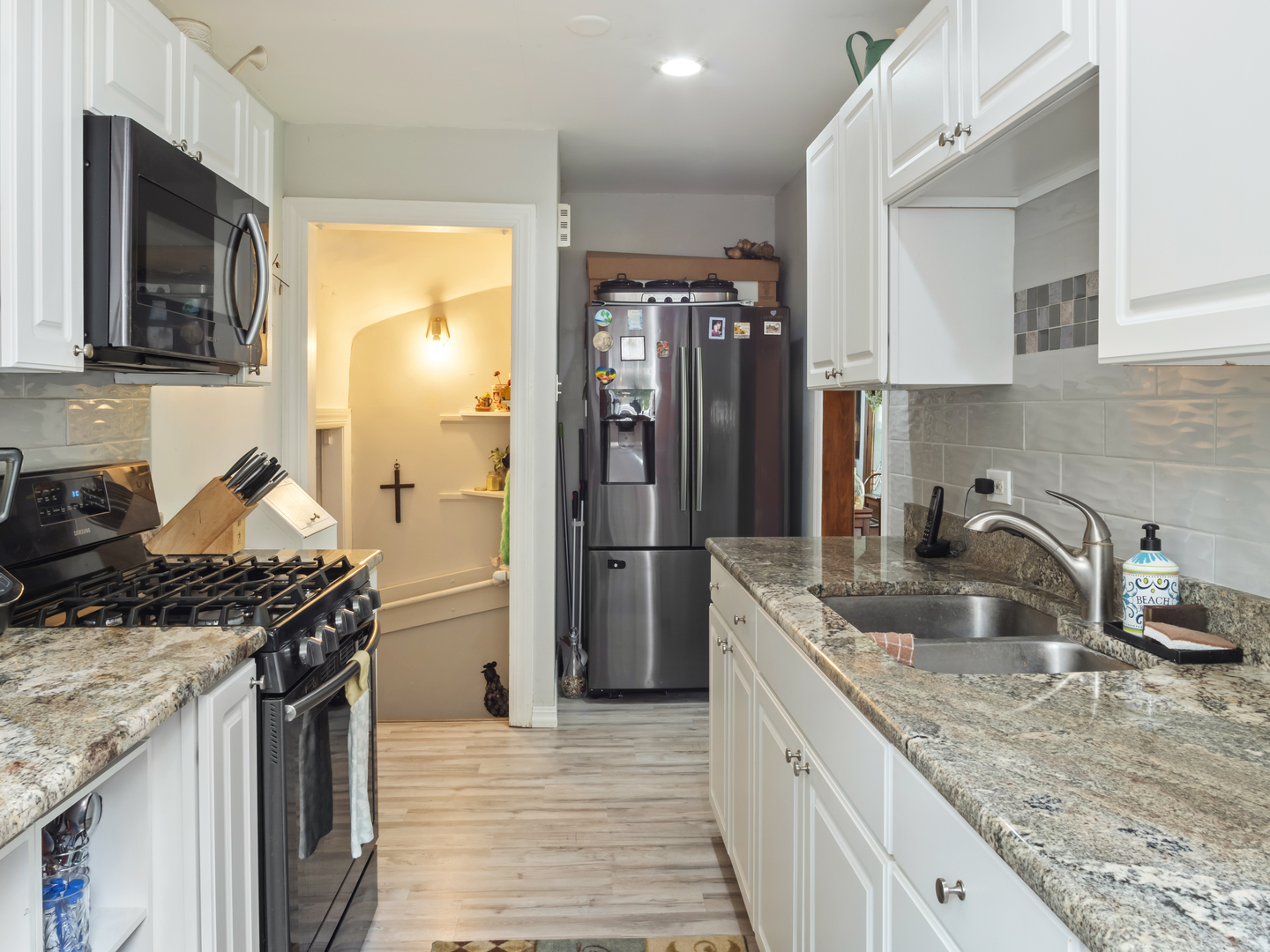 72 Radnor Lane Crete, IL 60417 - Photo 11 of 25 a kitchen with stainless steel appliances granite countertop a sink stove and refrigerator