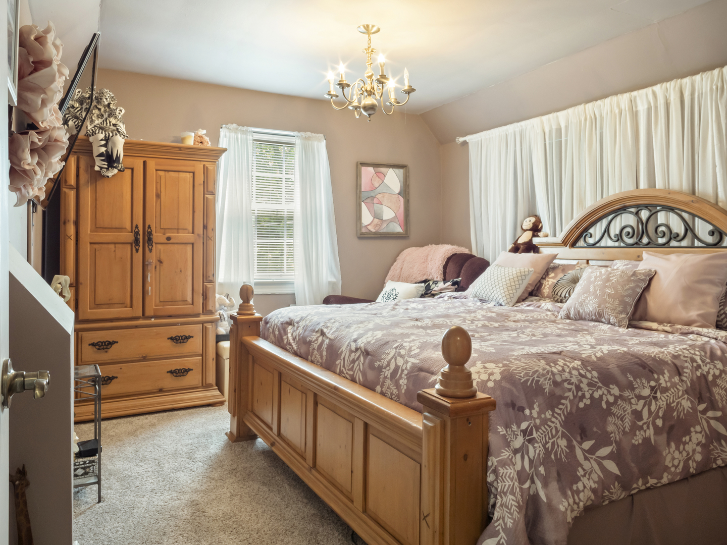 72 Radnor Lane Crete, IL 60417 - Photo 13 of 25 a bedroom with a bed and a chandelier