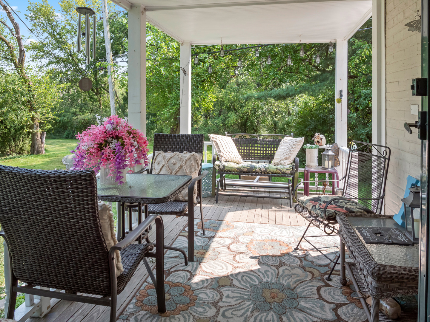 72 Radnor Lane Crete, IL 60417 - Photo 22 of 25 a view of a patio with a dining table and chairs