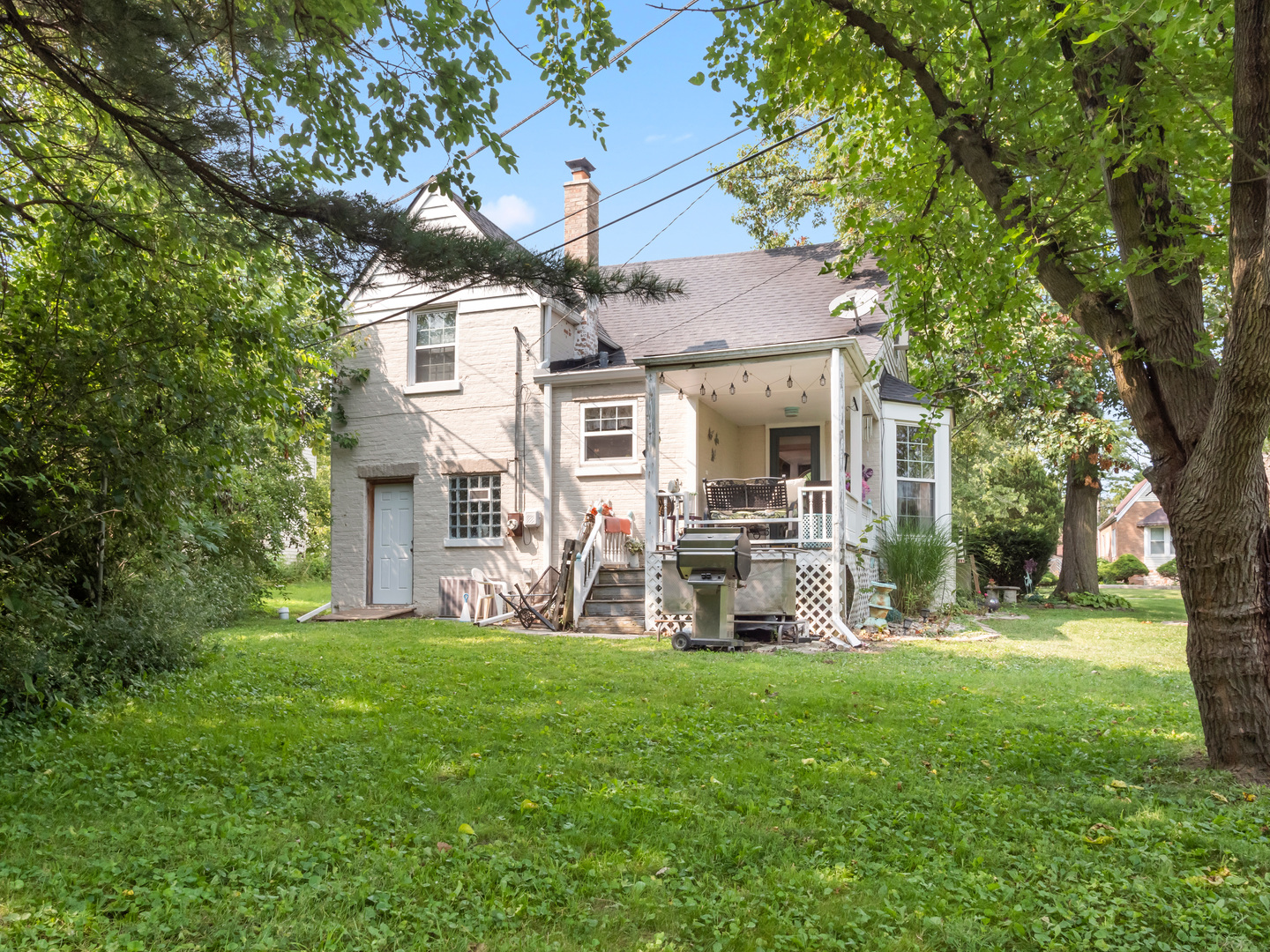 72 Radnor Lane Crete, IL 60417 - Photo 23 of 25 a front view of a house with garden and trees