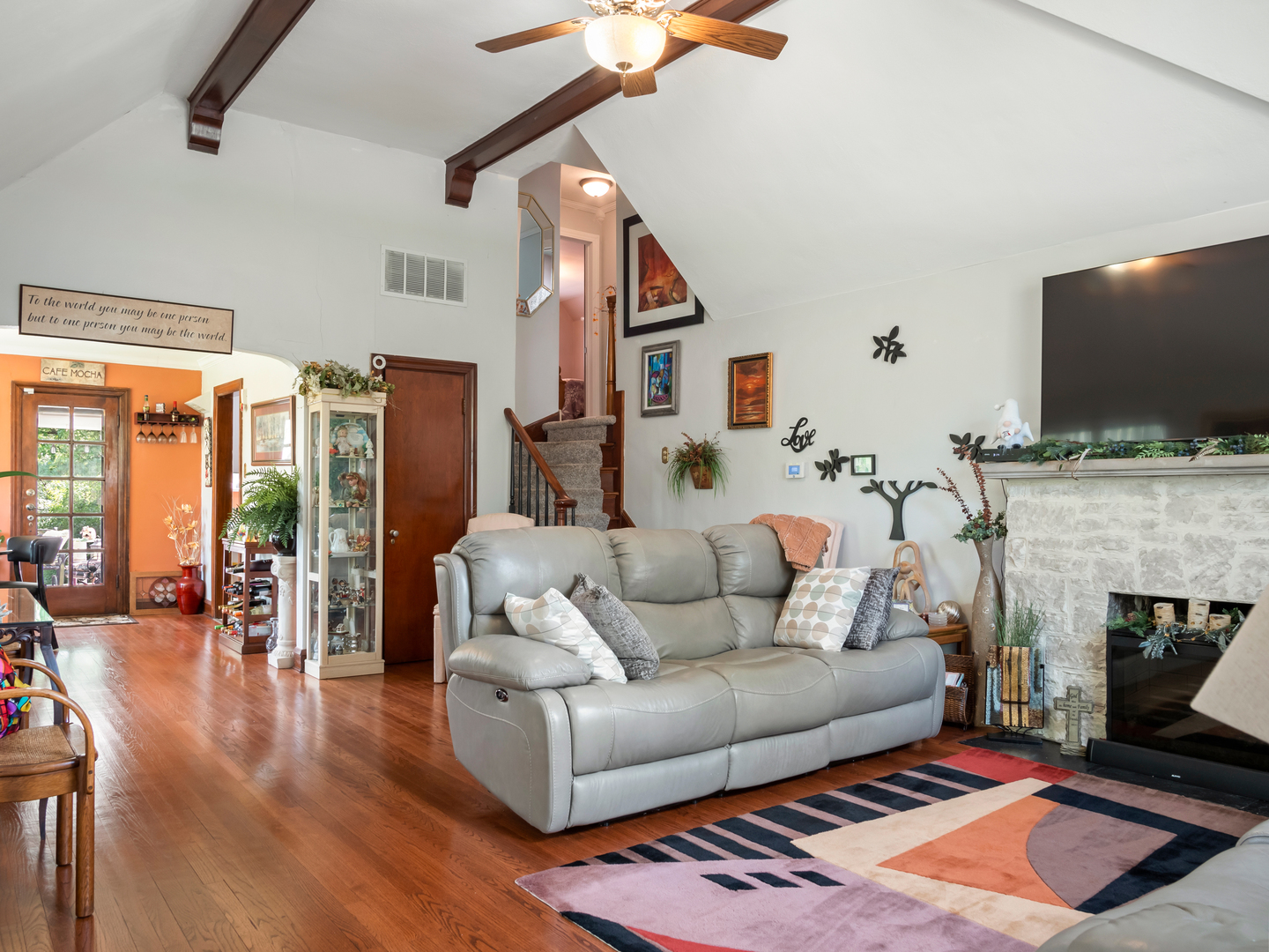 72 Radnor Lane Crete, IL 60417 - Photo 4 of 25 a living room with furniture a flat screen tv and a fireplace