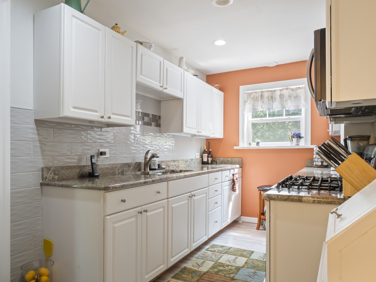 72 Radnor Lane Crete, IL 60417 - Photo 9 of 25 a kitchen with stainless steel appliances granite countertop a sink stove and cabinets