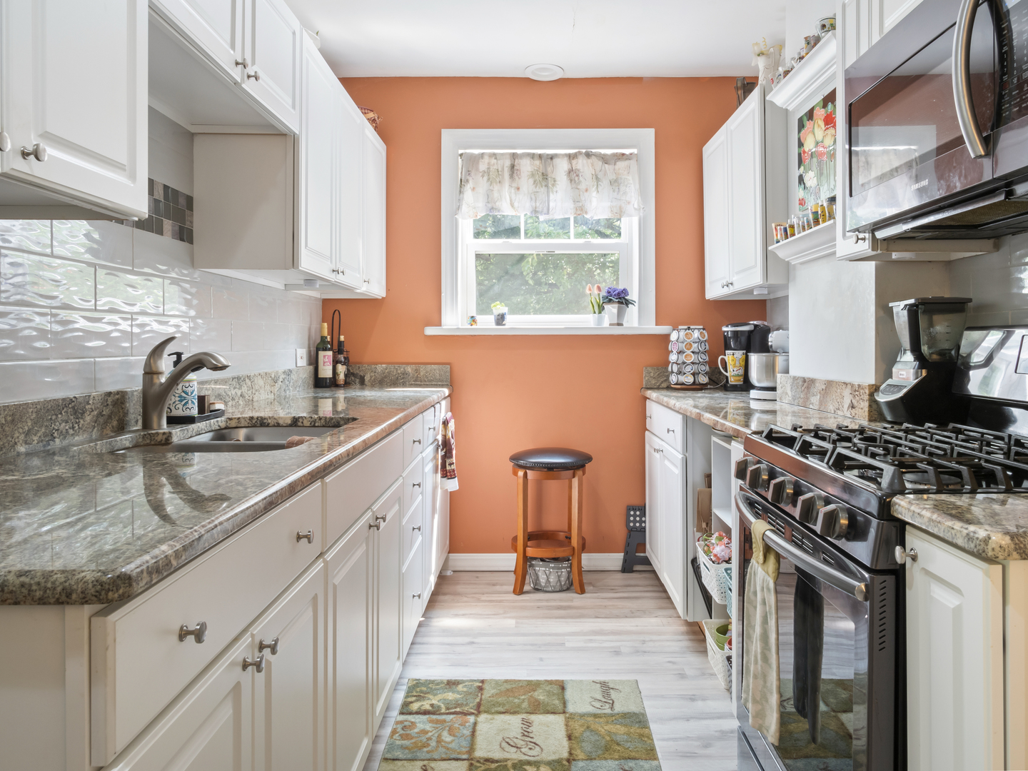 72 Radnor Lane Crete, IL 60417 - Photo 10 of 25 a kitchen with stainless steel appliances granite countertop a sink stove and cabinets
