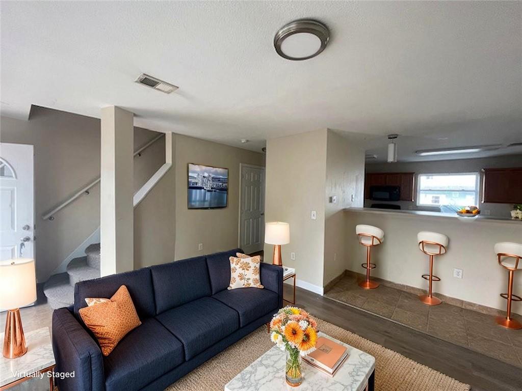 151 Plum Way California, PA 15419 - Photo 2 of 19 a living room with furniture and a flat screen tv