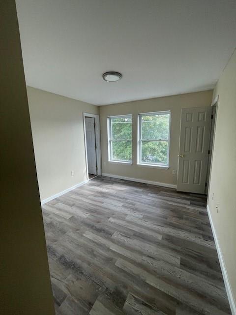 151 Plum Way California, PA 15419 - Photo 8 of 19 a view of an empty room with wooden floor and a window