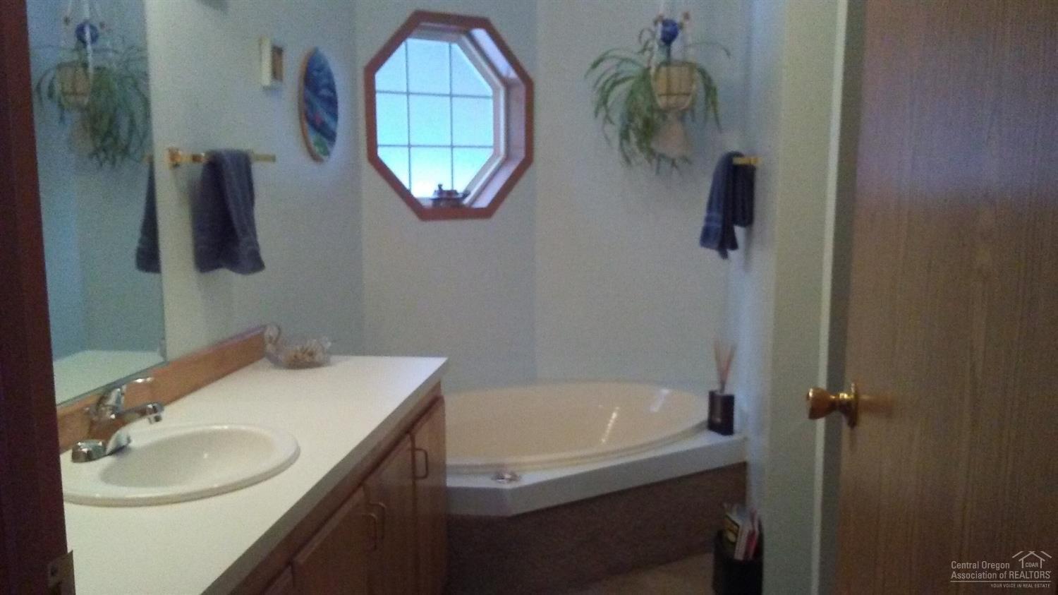 19073 Baker Road Bend, OR 97702 - Photo 9 of 14 a bathroom with a sink and a mirror