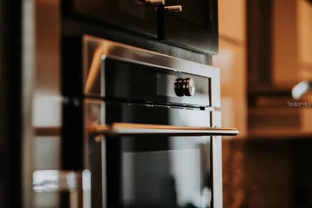 a stove top oven sitting inside of a kitchen
