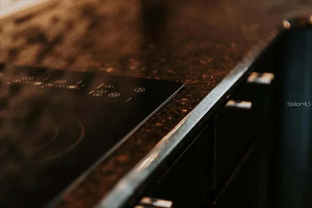 a view of a chairs and table in the backyard