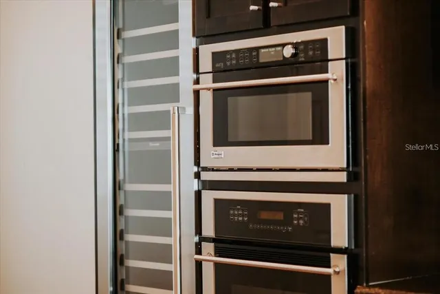 an aerial view of a house with outdoor space and lake view