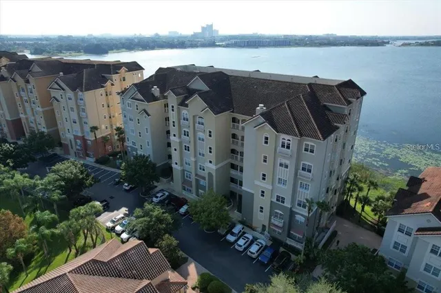 aerial view of a house with a lake view