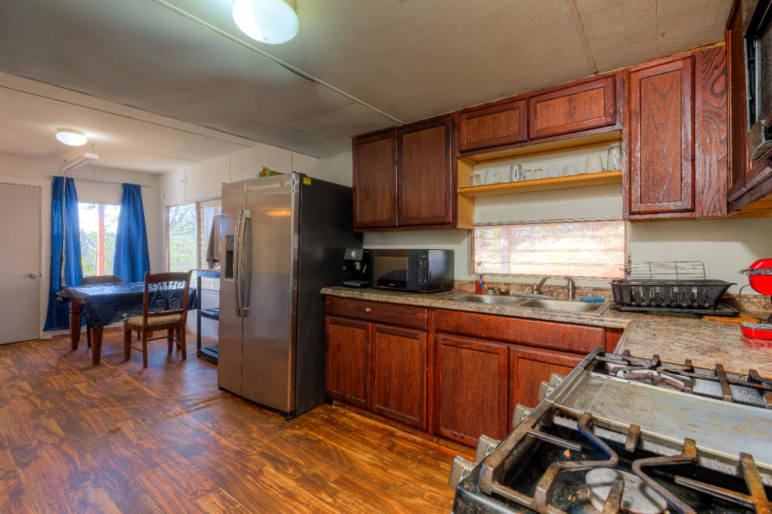 0 Black Tail Road Oroville, CA 95966 - Photo 7 of 33 a kitchen with stainless steel appliances a refrigerator a sink a stove and cabinets