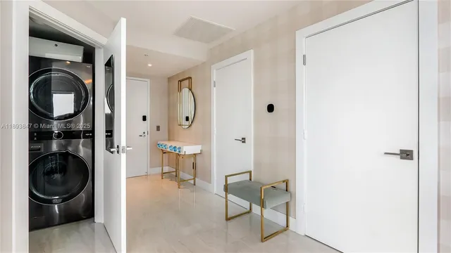 a view of a hallway with washer and dryer