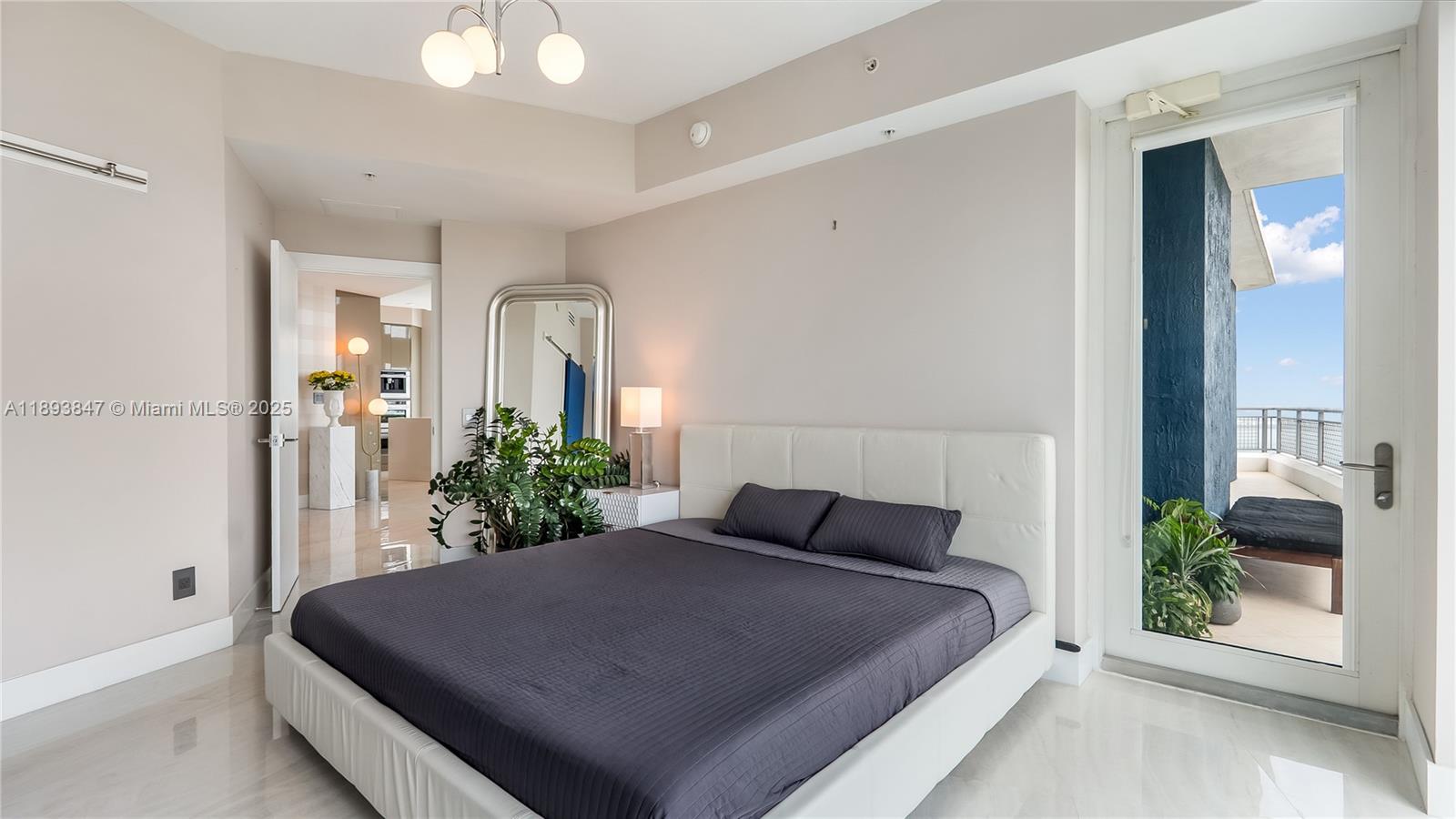 60 Southwest 13th Street, Unit 4200 Miami, FL 33130 - Photo 17 of 52 a bedroom with a bed and a potted plant