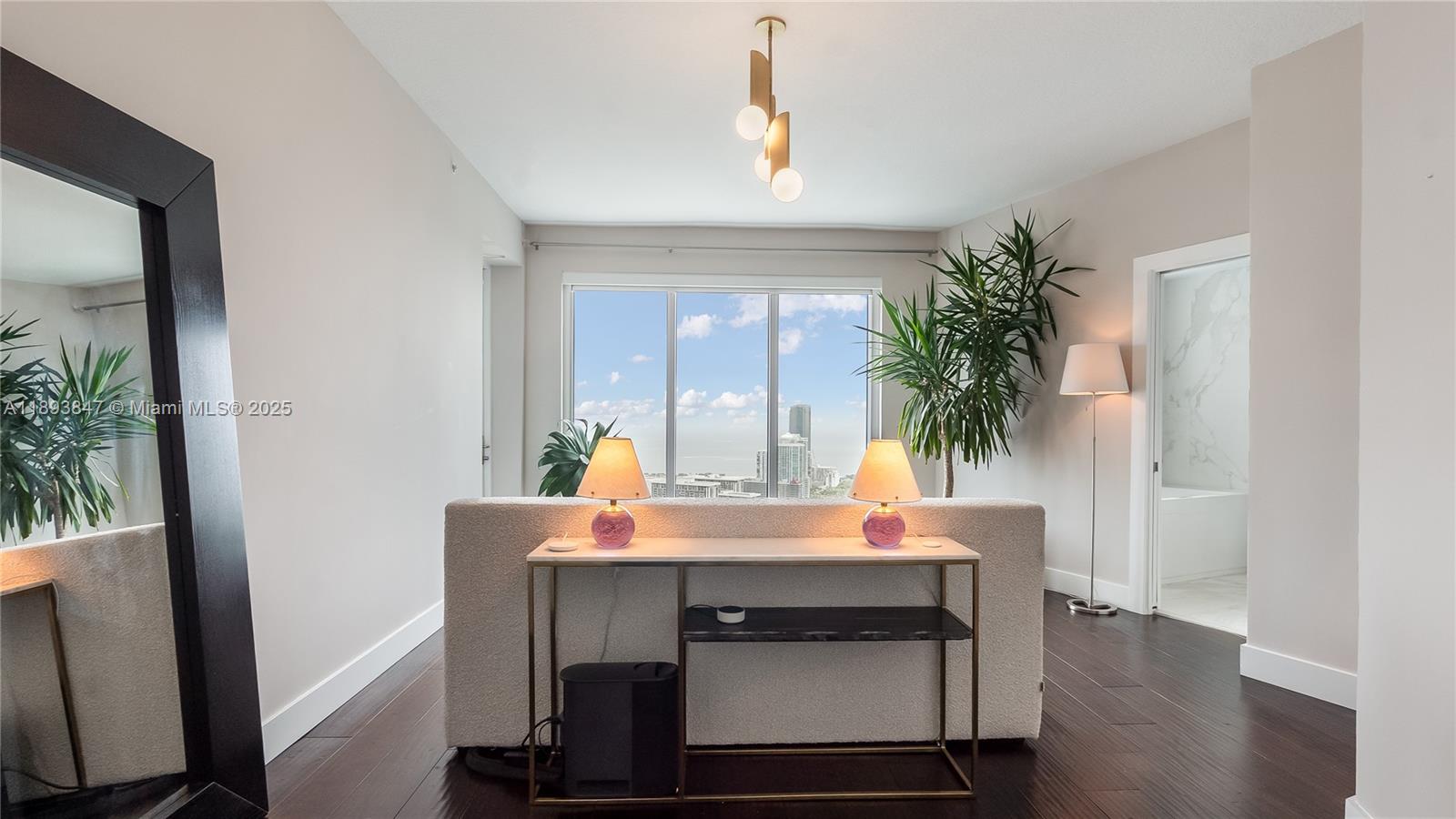 60 Southwest 13th Street, Unit 4200 Miami, FL 33130 - Photo 30 of 52 a living room with furniture and a potted plant