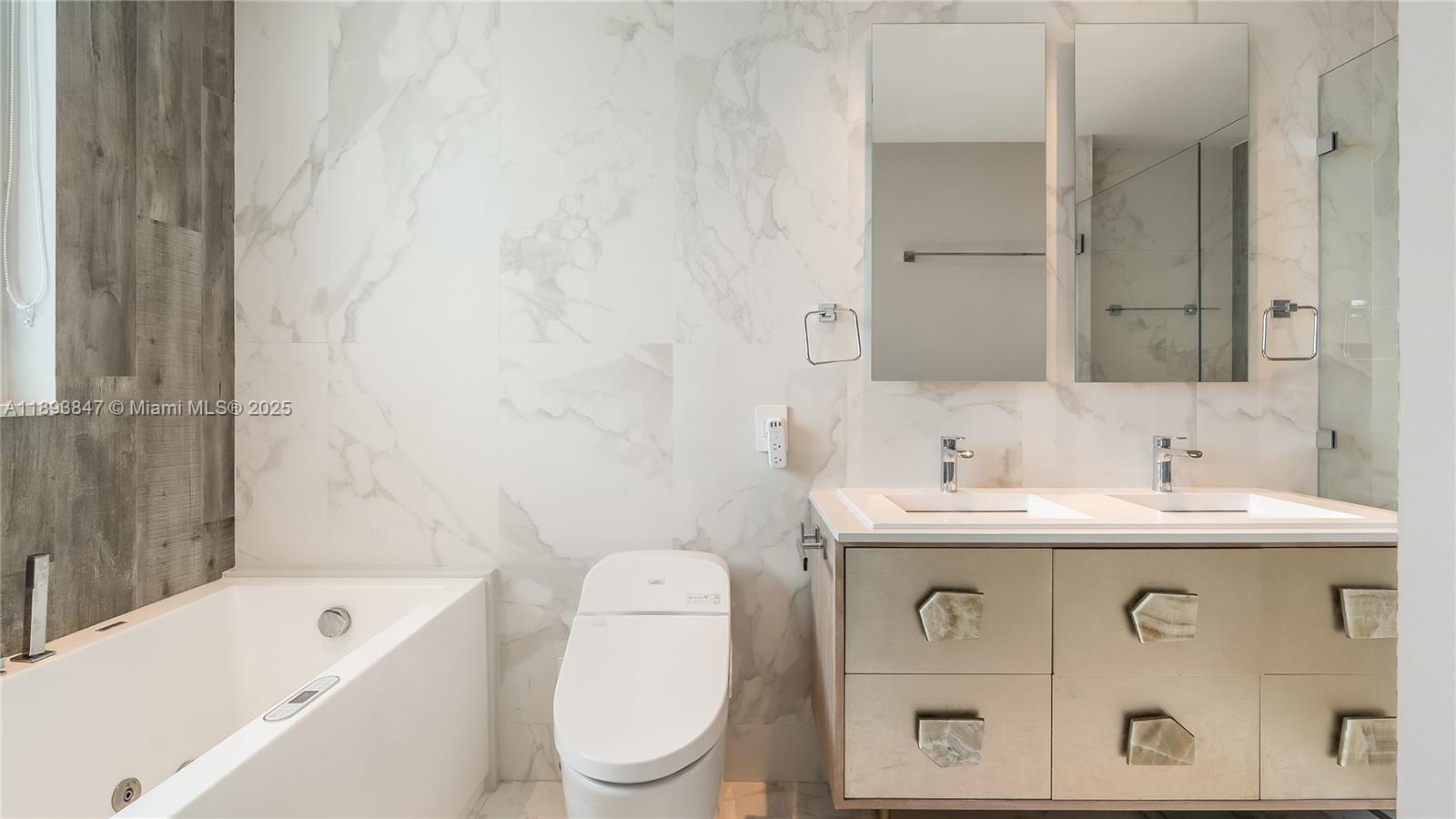 60 Southwest 13th Street, Unit 4200 Miami, FL 33130 - Photo 34 of 52 a bathroom with a sink a toilet and shower