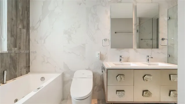 a bathroom with a sink a toilet and a bathtub